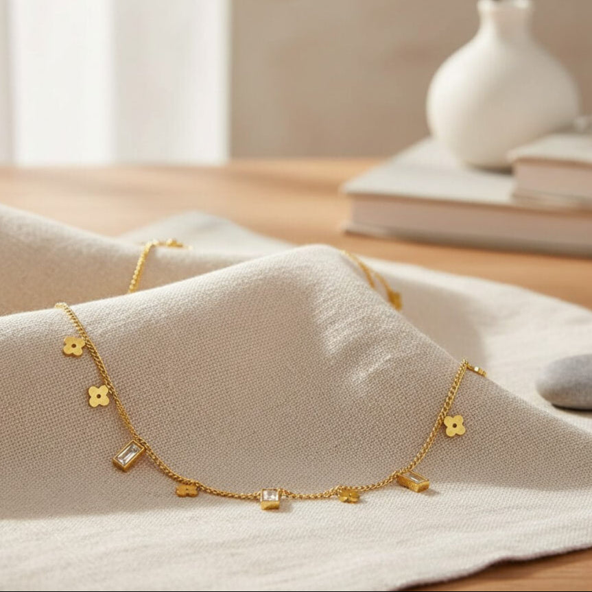 Gold bracelet on a soft fabric surface with a blurred background